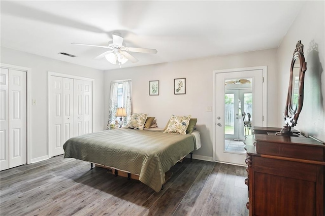 265 Cindy Lou Pl, Mandeville, LA 70448 - bedroom with multiple closets, multiple windows, french doors, and wood finished floors