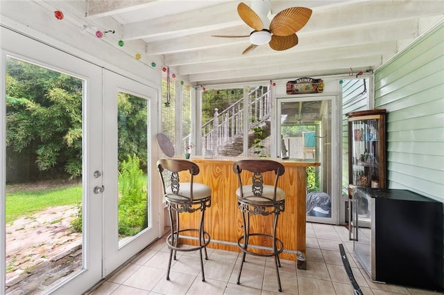 265 Cindy Lou Pl, Mandeville, LA 70448 - sunroom with tile patterned flooring, plenty of natural light, beamed ceiling, and ceiling fan