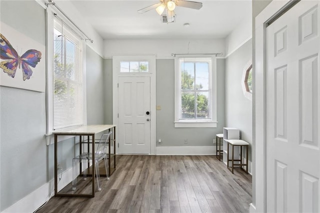330406 Conti St, New Orleans, LA 70119 - foyer entrance with wood finished floors, a ceiling fan, and baseboards