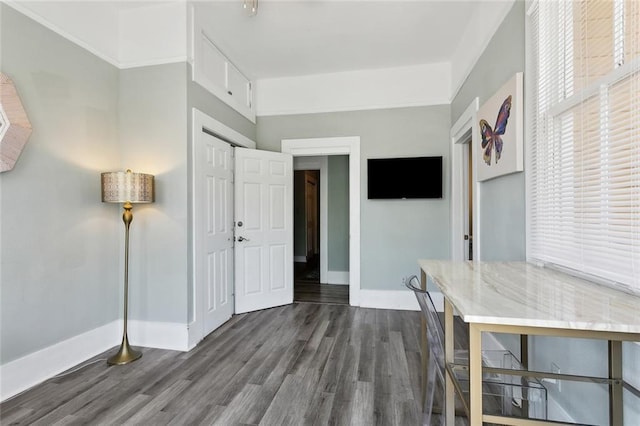 330406 Conti St, New Orleans, LA 70119 - home office with baseboards and dark wood finished floors