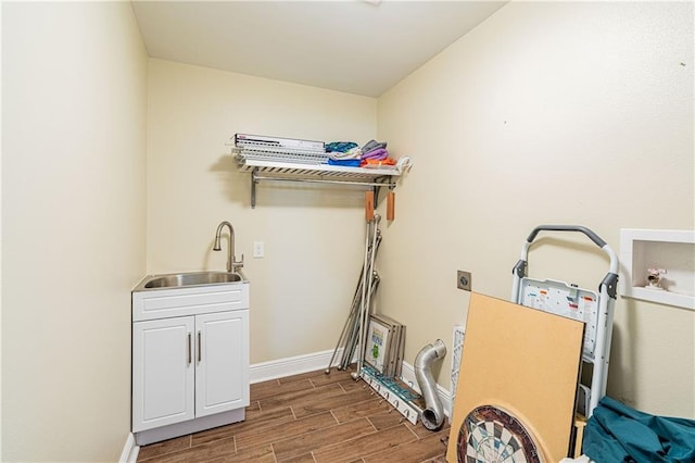 234 Murray Hill Dr, Destrehan, LA 70047 - laundry area featuring hookup for an electric dryer, dark wood-style flooring, cabinet space, baseboards, and hookup for a washing machine