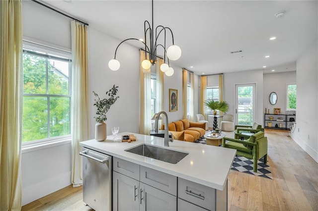 3431 Chartres St Unit 3, New Orleans, LA 70117 - kitchen featuring a sink, stainless steel dishwasher, gray cabinets, light wood-type flooring, and recessed lighting