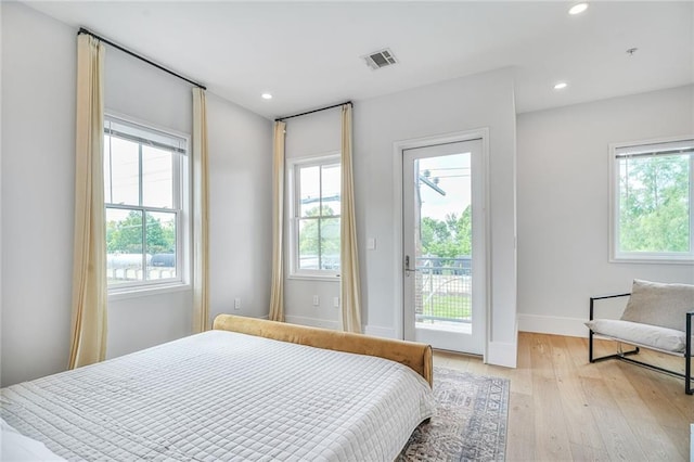 3431 Chartres St Unit 3, New Orleans, LA 70117 - bedroom featuring access to exterior, light wood-style floors, baseboards, and recessed lighting
