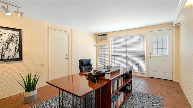 5000 Senac Dr, Metairie, LA 70003 - office area featuring brick patterned flooring and a wall unit AC