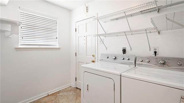 5000 Senac Dr, Metairie, LA 70003 - washroom featuring separate washer and dryer and baseboards