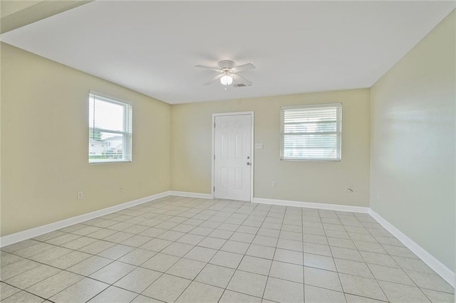 711921 Marshal Foch St, New Orleans, LA 70124 - spare room featuring plenty of natural light, a ceiling fan, baseboards, and light tile patterned floors