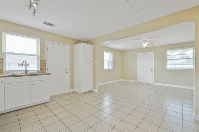 711921 Marshal Foch St, New Orleans, LA 70124 - entrance foyer featuring baseboards, healthy amount of natural light, a ceiling fan, and light tile patterned floors