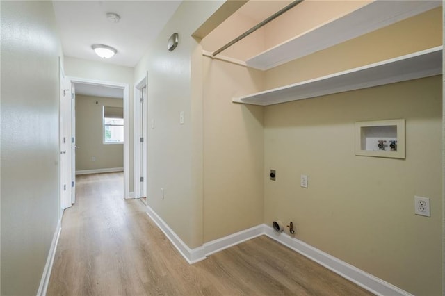 711921 Marshal Foch St, New Orleans, LA 70124 - laundry area with hookup for a gas dryer, washer hookup, hookup for an electric dryer, light wood-style flooring, and baseboards