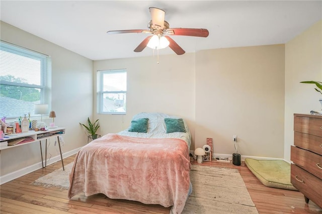 711921 Marshal Foch St, New Orleans, LA 70124 - bedroom featuring hardwood / wood-style floors, baseboards, and a ceiling fan