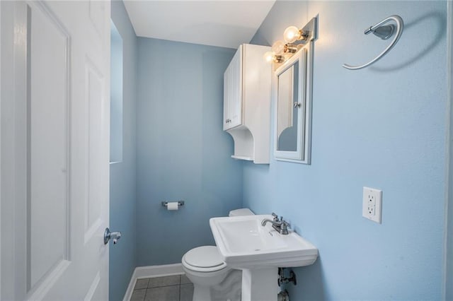 711921 Marshal Foch St, New Orleans, LA 70124 - half bath with tile patterned flooring, toilet, and baseboards