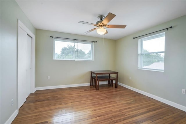 711921 Marshal Foch St, New Orleans, LA 70124 - bedroom featuring wood finished floors, multiple windows, and baseboards