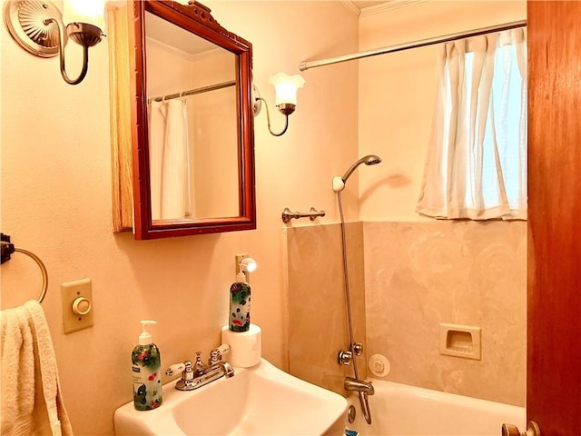 3754 Roman St, Metairie, LA 70001 - bathroom featuring a sink, crown molding, and shower / tub combo