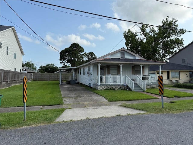 3754 Roman St, Metairie, LA 70001 - view of front of home with a porch, concrete driveway, and a carport