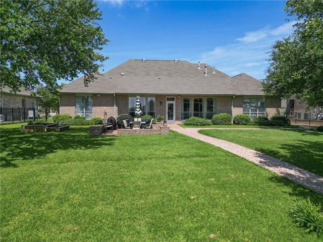 2044 S Lakeshore Blvd, Slidell, LA 70461 - back of house with a patio area, brick siding, and roof with shingles