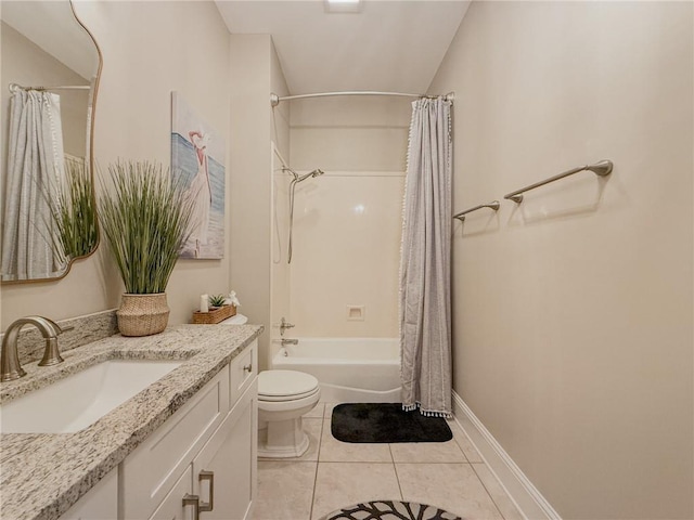 2044 S Lakeshore Blvd, Slidell, LA 70461 - bathroom featuring toilet, vanity, shower / bath combo, tile patterned flooring, and baseboards