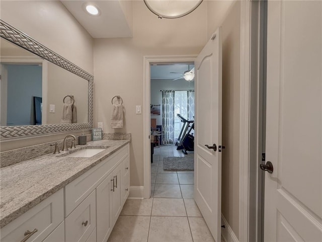 2044 S Lakeshore Blvd, Slidell, LA 70461 - bathroom featuring vanity, baseboards, tile patterned floors, and ceiling fan