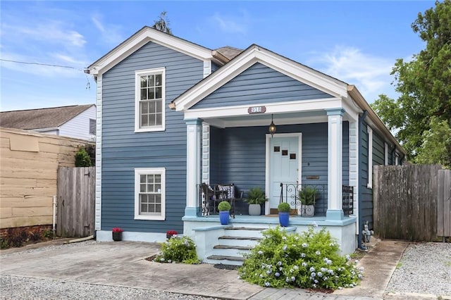 918 Harmony St, New Orleans, LA 70115 - shotgun-style home featuring covered porch