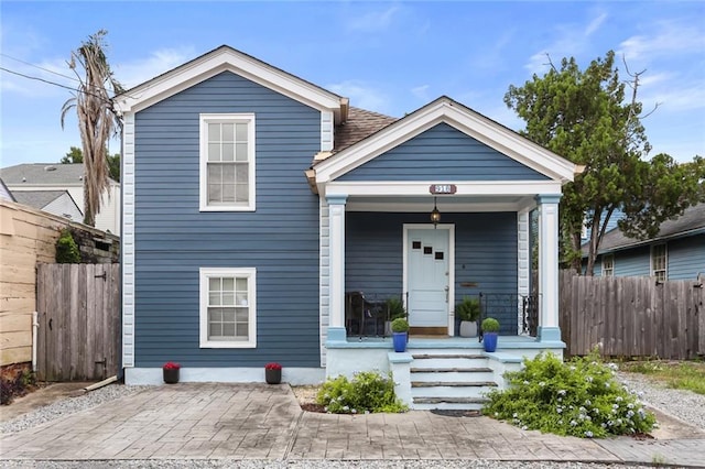 918 Harmony St, New Orleans, LA 70115 - shotgun-style home with a porch