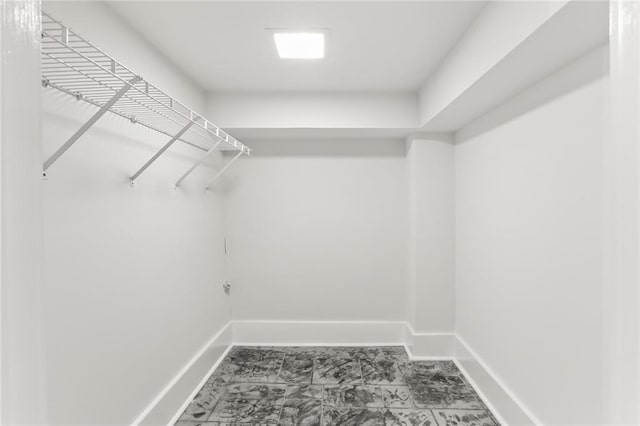 918 Harmony St, New Orleans, LA 70115 - walk in closet with marble look tile flooring