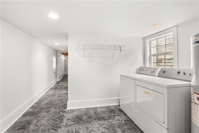 918 Harmony St, New Orleans, LA 70115 - washroom with washer and dryer, baseboards, recessed lighting, and marble finish floors
