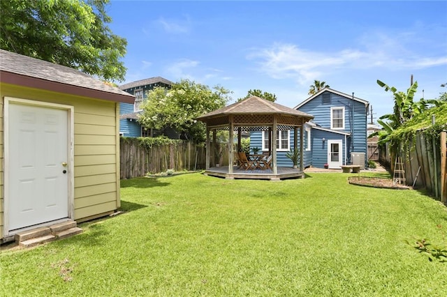 918 Harmony St, New Orleans, LA 70115 - rear view of house featuring a gazebo, a deck, and central AC unit