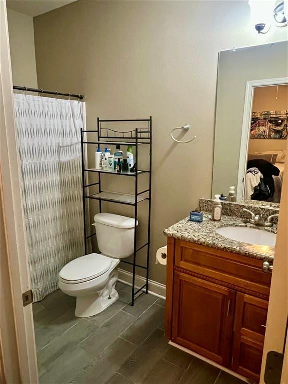 1362 Brightside Ln Unit 201, Baton Rouge, LA 70820 - bathroom featuring vanity, toilet, and a shower with curtain