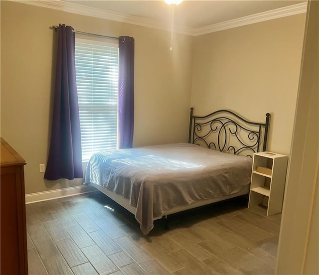 1362 Brightside Ln Unit 201, Baton Rouge, LA 70820 - bedroom with ornamental molding, wood finished floors, and baseboards