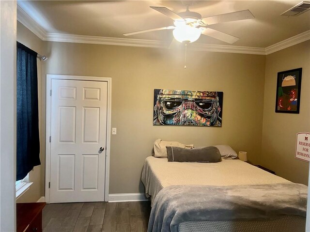 1362 Brightside Ln Unit 201, Baton Rouge, LA 70820 - bedroom featuring dark wood-type flooring, crown molding, baseboards, and a ceiling fan