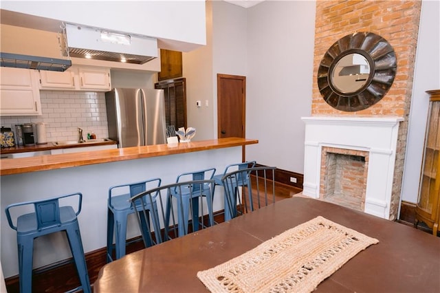 1438-40 Marais St, New Orleans, LA 70116 - dining room featuring a fireplace and baseboards