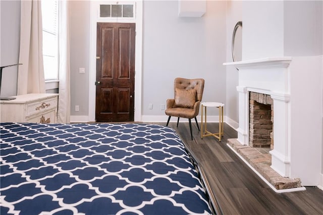 1438-40 Marais St, New Orleans, LA 70116 - bedroom featuring dark wood-style floors, baseboards, and a fireplace
