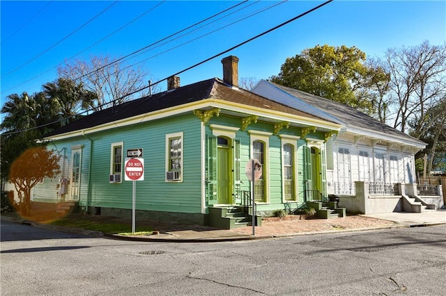 1438-40 Marais St, New Orleans, LA 70116 - view of side of property with a chimney