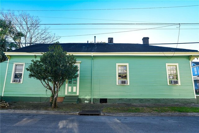 1438-40 Marais St, New Orleans, LA 70116 - view of side of property with entry steps and a chimney