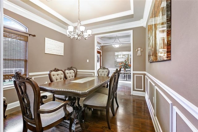 113 Kasey St, Slidell, LA 70458 - dining room with a chandelier, a tray ceiling, healthy amount of natural light, dark wood-style floors, and crown molding