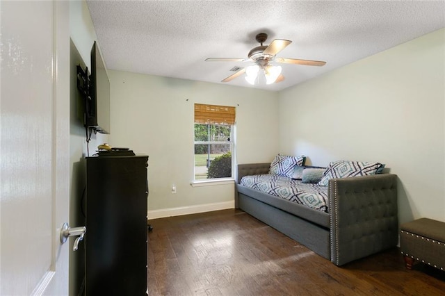 113 Kasey St, Slidell, LA 70458 - bedroom with wood finished floors, baseboards, ceiling fan, and a textured ceiling