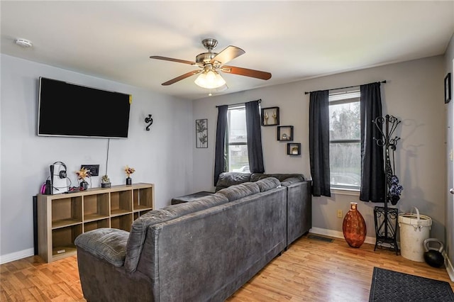 6223 Wainwright Dr, New Orleans, LA 70122 - living room with ceiling fan, light wood-style floors, and baseboards
