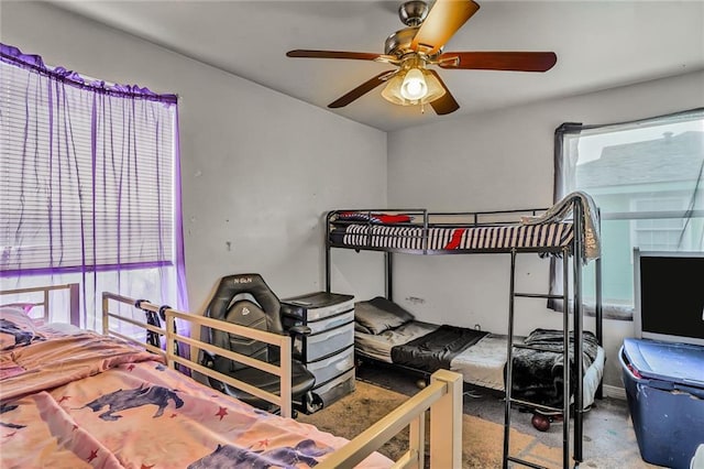 6223 Wainwright Dr, New Orleans, LA 70122 - bedroom with multiple windows, carpet floors, and ceiling fan