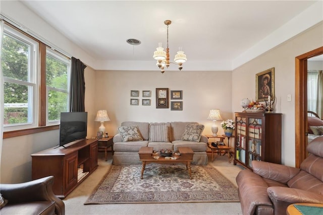11 Gelbke Dr, Gretna, LA 70053 - living room with light carpet and a chandelier
