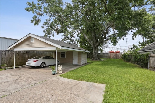 11 Gelbke Dr, Gretna, LA 70053 - view of yard featuring a carport and concrete driveway