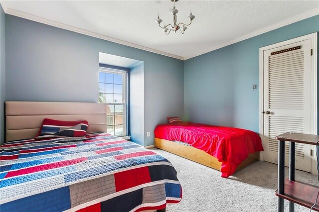 4525 Beau Lac Ln, Metairie, LA 70002 - bedroom featuring carpet floors, ornamental molding, and a chandelier