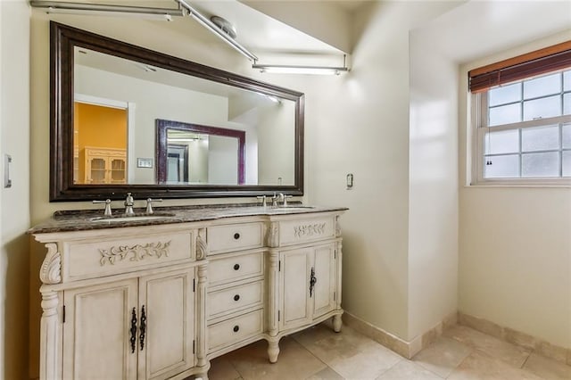 4525 Beau Lac Ln, Metairie, LA 70002 - full bathroom with double vanity and tile patterned flooring