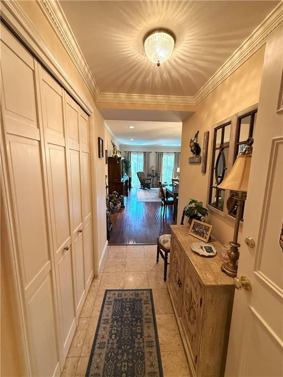 1441 Jackson Ave Unit 3A, New Orleans, LA 70130 - hall featuring light tile patterned floors and crown molding