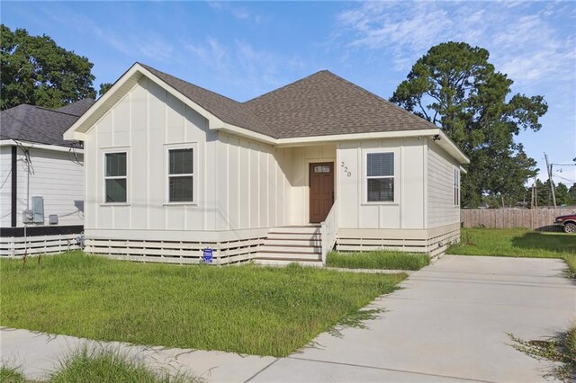 220 Trudeau Dr, Metairie, LA 70003 - view of front of house featuring board and batten siding and a shingled roof