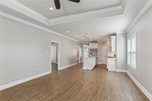 220 Trudeau Dr, Metairie, LA 70003 - unfurnished living room with a sink, ceiling fan, light wood-type flooring, recessed lighting, and ornamental molding