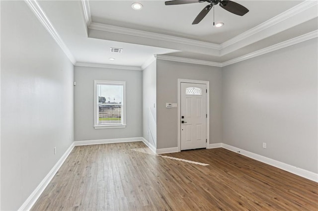 220 Trudeau Dr, Metairie, LA 70003 - entrance foyer with wood finished floors, a ceiling fan, ornamental molding, a raised ceiling, and baseboards