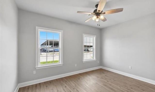 220 Trudeau Dr, Metairie, LA 70003 - spare room featuring healthy amount of natural light, wood finished floors, and baseboards