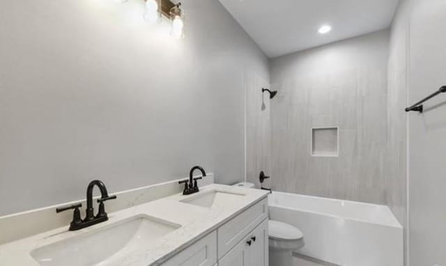 220 Trudeau Dr, Metairie, LA 70003 - bathroom featuring toilet, double vanity, and bathing tub / shower combination