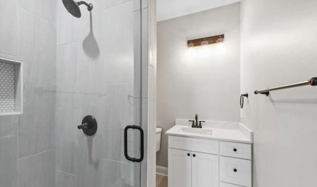 220 Trudeau Dr, Metairie, LA 70003 - bathroom with a stall shower, vanity, and toilet