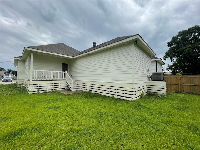 220 Trudeau Dr, Metairie, LA 70003 - rear view of house with central air condition unit and roof with shingles