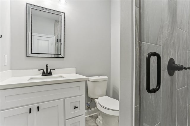220 Trudeau Dr, Metairie, LA 70003 - full bath featuring toilet, vanity, a stall shower, and baseboards