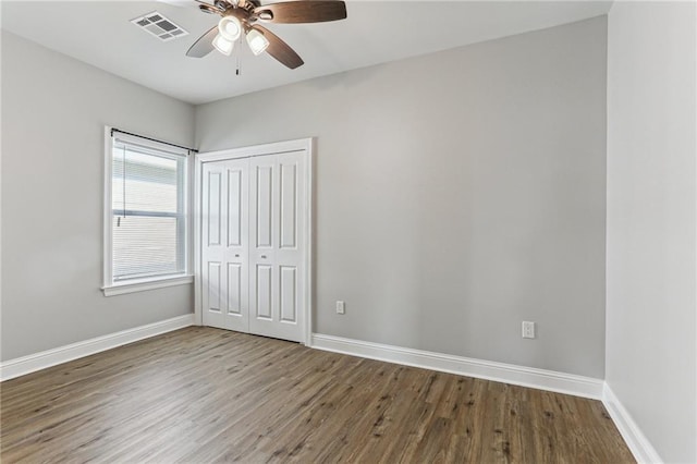 220 Trudeau Dr, Metairie, LA 70003 - unfurnished bedroom featuring wood finished floors, baseboards, a closet, and ceiling fan